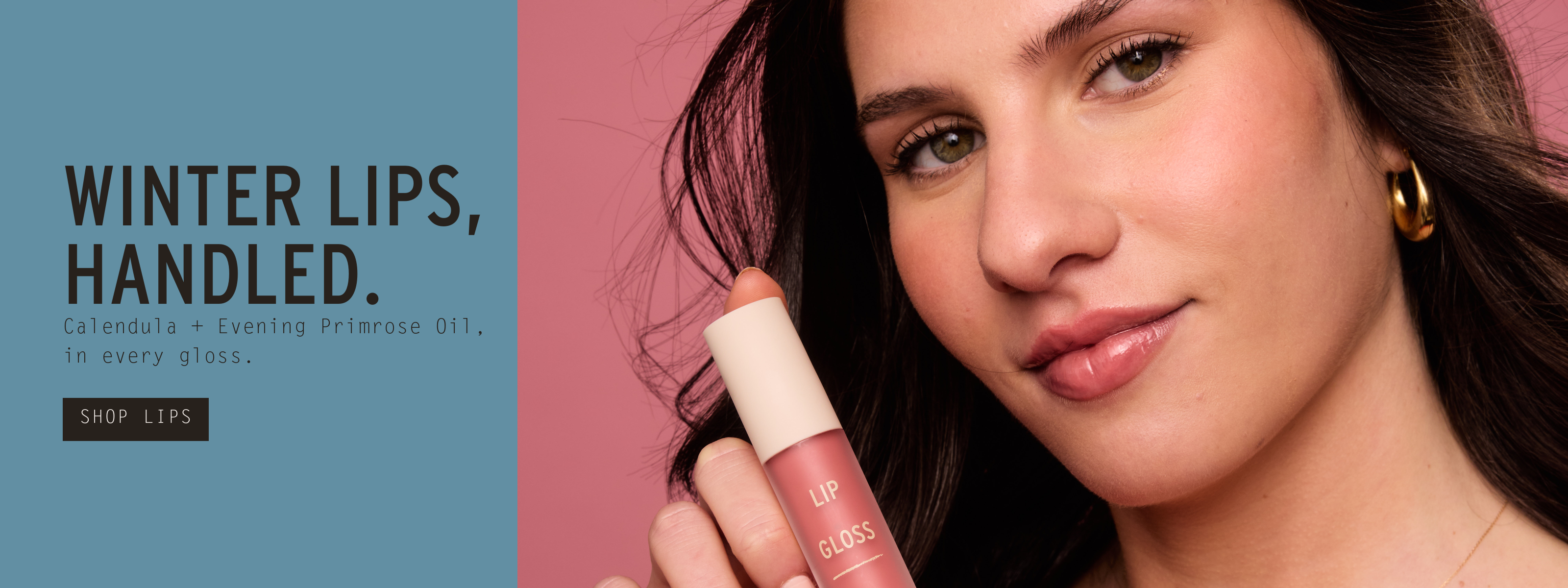 Winter lips, handled — Calendula and Evening Primrose Oil in every gloss. Model in red knit holding Bloom Lip Gloss to her lips. Shop Lips. Australian made since 1993.